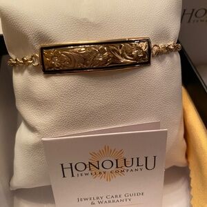 HONOLULU JEWELRY CO 14KT ID BRACELET PLUMERIA FLOWERS W/ 3 DIAMONDS 18KT SAFETY